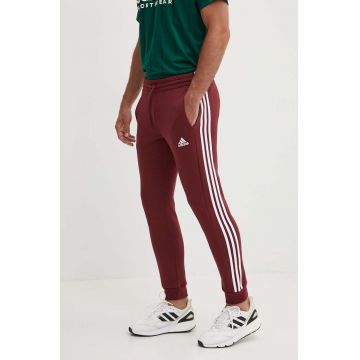 adidas pantaloni de trening Essentials culoarea bordo, cu imprimeu, JG5951