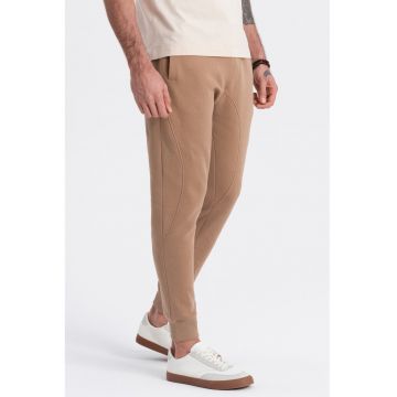 Pantaloni de trening cu croiala conica si snur de ajustare