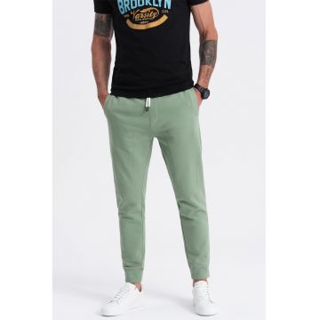 Pantaloni de trening cu croiala conica si snur de ajustare