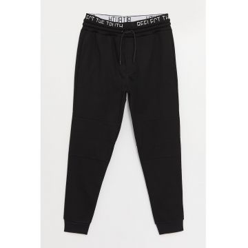 Pantaloni jogger slim fit cu banda text in talie