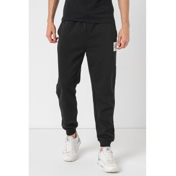 Pantaloni de trening conici cu buzunare oblice