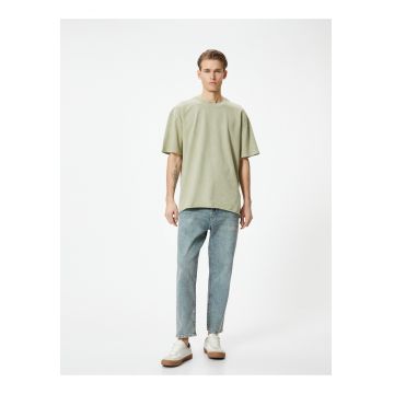 Blugi relaxed fit cu aspect decolorat Steve