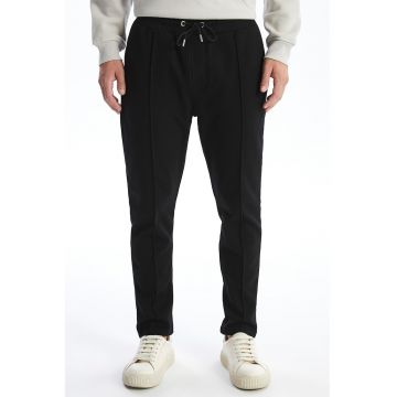 Pantaloni de trening cambrati cu snur de ajustare si model uni