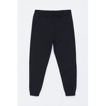 Pantaloni de trening conici cu buzunare oblice