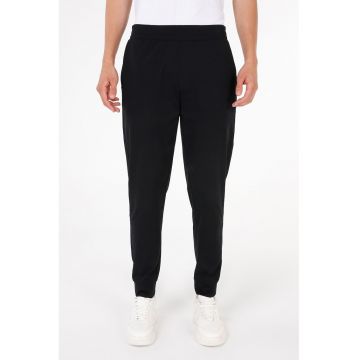 Pantaloni jogger uni cu croiala conica