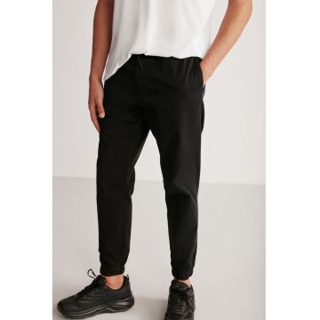 Pantaloni de trening cu buzunare laterale Jakob